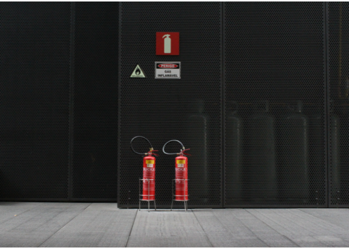 fire extinguishers against black background